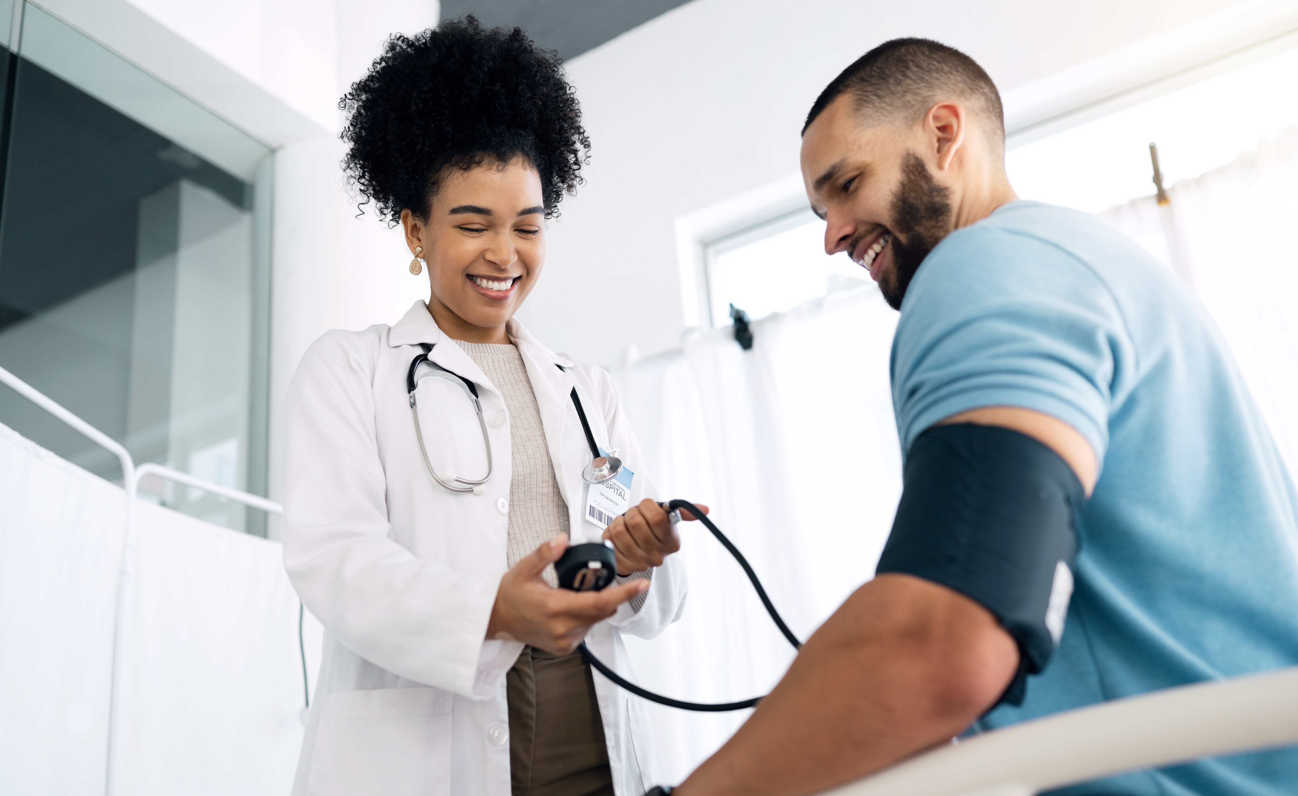 Doctor performing blood pressure check